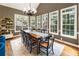 Bright dining room with large windows, offering ample seating and natural light at 10530 Tuxford Dr, Alpharetta, GA 30022