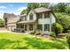 Beautiful home with manicured landscaping, a welcoming porch, and a two-car garage at 10530 Tuxford Dr, Alpharetta, GA 30022