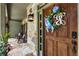Charming front porch with rocking chairs and stone details leading to a decorative wooden front door at 10530 Tuxford Dr, Alpharetta, GA 30022