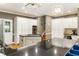 Spacious kitchen featuring stainless steel appliances, gas cooktop island, and ample cabinet storage at 10530 Tuxford Dr, Alpharetta, GA 30022