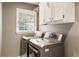 Laundry room equipped with a window and modern washer and dryer units at 10530 Tuxford Dr, Alpharetta, GA 30022