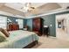 This bedroom features a wooden bed frame, matching furniture, and an open doorway to a hallway at 10530 Tuxford Dr, Alpharetta, GA 30022