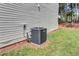 Exterior shot of the home's AC unit with manicured lawn at 2169 Wingfoot Pl, Decatur, GA 30035