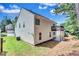 View of the backyard showcasing the siding, balcony, and patio at 2169 Wingfoot Pl, Decatur, GA 30035