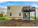 The backyard offers a deck, covered patio and an expansive lawn for outdoor enjoyment at 2169 Wingfoot Pl, Decatur, GA 30035