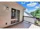 Balcony features siding and a sliding door with wooded backdrop at 2169 Wingfoot Pl, Decatur, GA 30035
