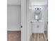 Bathroom view showcasing modern vanity, arched mirror and stylish fixtures at 2169 Wingfoot Pl, Decatur, GA 30035
