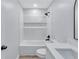 All-white bathroom with a shower and tub combination, black fixtures, and white vanity at 2169 Wingfoot Pl, Decatur, GA 30035