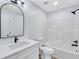 Bathroom with modern vanity, a framed mirror, and a shower-tub combination at 2169 Wingfoot Pl, Decatur, GA 30035