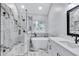 Luxurious bathroom featuring a glass shower, soaking tub, double vanity, and designer finishes at 2169 Wingfoot Pl, Decatur, GA 30035