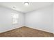 Bedroom featuring neutral carpet, a bright window, and ample space at 2169 Wingfoot Pl, Decatur, GA 30035