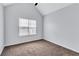 Bright bedroom featuring neutral walls, plush carpet, and a large window offering ample natural light at 2169 Wingfoot Pl, Decatur, GA 30035