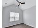 Bedroom with vaulted ceilings, neutral carpeting, and a ceiling fan for comfort at 2169 Wingfoot Pl, Decatur, GA 30035