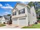 Classic two-story home features a two-car garage and inviting front entry at 2169 Wingfoot Pl, Decatur, GA 30035