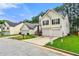 Charming two-story home features an attached two-car garage and well-kept lawn at 2169 Wingfoot Pl, Decatur, GA 30035