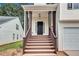 Exterior of front entrance showing wooden stairs and dark door at 2169 Wingfoot Pl, Decatur, GA 30035