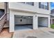 Spacious two-car garage with concrete floors, and updated lighting at 2169 Wingfoot Pl, Decatur, GA 30035