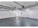 Spacious two car garage featuring an automatic door and smooth concrete floors at 2169 Wingfoot Pl, Decatur, GA 30035