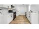 Kitchen featuring white cabinets, modern black hardware and appliances, and marble countertops at 2169 Wingfoot Pl, Decatur, GA 30035