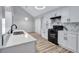 Modern kitchen with bright lighting, white cabinets, and stainless steel appliances at 2169 Wingfoot Pl, Decatur, GA 30035
