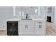 Kitchen peninsula with a black dishwasher and an undermount sink with a modern black faucet at 2169 Wingfoot Pl, Decatur, GA 30035