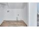Bright laundry area with wood floors and functional hookups, ready for appliances at 2169 Wingfoot Pl, Decatur, GA 30035
