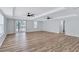 Open living room has natural light, wood floors, and direct access to the outside at 2169 Wingfoot Pl, Decatur, GA 30035
