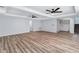 Open living room with wood floors, recessed lighting and ceiling fans, offering a bright and inviting space at 2169 Wingfoot Pl, Decatur, GA 30035
