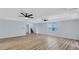 Spacious living room featuring wood floors, recessed lighting, and a modern ceiling fan at 2169 Wingfoot Pl, Decatur, GA 30035