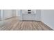 Open-concept layout featuring wood floors and a view into the modern kitchen at 2169 Wingfoot Pl, Decatur, GA 30035