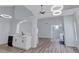Open living room features hardwood floors, high ceilings, and modern light fixtures in neutral colors at 2169 Wingfoot Pl, Decatur, GA 30035