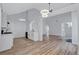 Open concept living area with modern lighting and bar access to the kitchen at 2169 Wingfoot Pl, Decatur, GA 30035