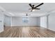 Large living room features wood floors, tray ceilings and ceiling fans at 2169 Wingfoot Pl, Decatur, GA 30035