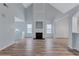 Open-concept living room with fireplace, vaulted ceilings, and hardwood floors at 2169 Wingfoot Pl, Decatur, GA 30035