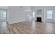 Spacious living room featuring wood floors, a fireplace, and neutral paint at 2169 Wingfoot Pl, Decatur, GA 30035