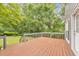 Wood deck with gray railings, adjacent to the house and yard at 405 W Leslie Ct, Woodstock, GA 30188
