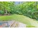 Landscaped backyard with stone steps and terraced yard at 405 W Leslie Ct, Woodstock, GA 30188