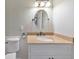 This bathroom features a stylish oval mirror above the vanity, complemented by a modern light fixture at 405 W Leslie Ct, Woodstock, GA 30188