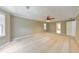 Spacious bedroom offering great natural light, neutral carpeting and paint at 405 W Leslie Ct, Woodstock, GA 30188