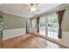 Bright dining area featuring access to the outdoors and wainscotting, perfect for Gathering meals at 405 W Leslie Ct, Woodstock, GA 30188