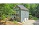 Charming two-story home features a two-car garage and beautiful landscaping at 405 W Leslie Ct, Woodstock, GA 30188