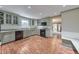 Well-lit kitchen featuring ample cabinet space, modern appliances, and granite countertops at 405 W Leslie Ct, Woodstock, GA 30188