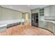 Open kitchen layout with stainless steel appliances and a convenient built-in seating area at 405 W Leslie Ct, Woodstock, GA 30188