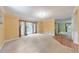 Inviting living room with large windows and neutral carpet, perfect for relaxation at 405 W Leslie Ct, Woodstock, GA 30188