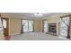 Inviting living room with a cozy fireplace and abundant natural light at 405 W Leslie Ct, Woodstock, GA 30188