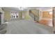 Cozy living room showcasing a fireplace and staircase at 405 W Leslie Ct, Woodstock, GA 30188