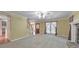 Bright living room featuring a fireplace, staircase, and natural light at 405 W Leslie Ct, Woodstock, GA 30188