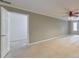 Spacious primary bedroom with a ceiling fan, natural light, and en-suite access at 405 W Leslie Ct, Woodstock, GA 30188