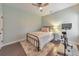 Bedroom with a ceiling fan, hardwood floors, and neutral color scheme at 456 Rockford Sw Pass, Marietta, GA 30064
