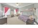 Bright bedroom with a bunk bed, a desk and large windows, creating a pleasant and functional space at 456 Rockford Sw Pass, Marietta, GA 30064